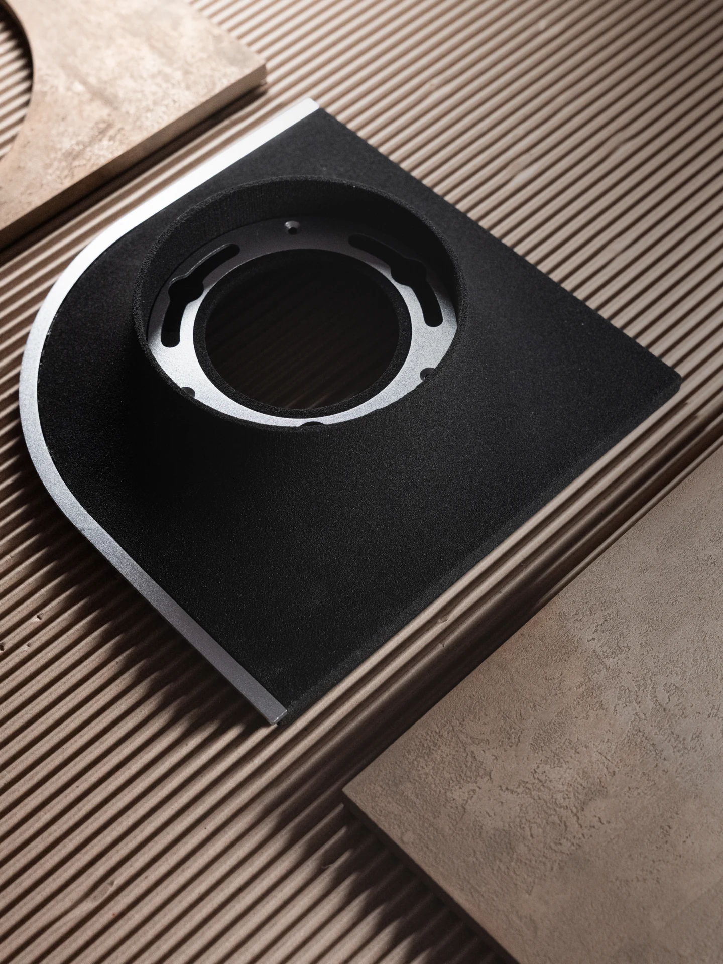 Strata Wall Light, black quartz sand + metal or wood surface, by Rollo Studio, view 8