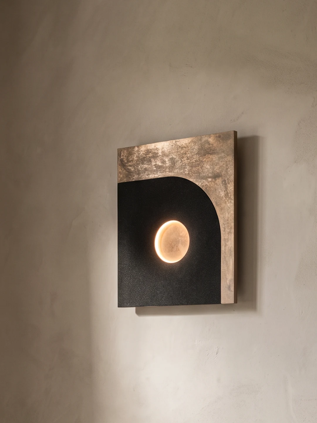 Strata Wall Light, black quartz sand + metal or wood surface, by Rollo Studio, view 3